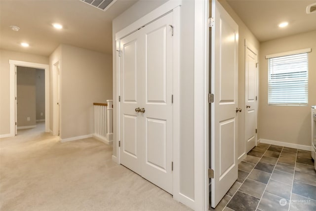 corridor with carpet floors