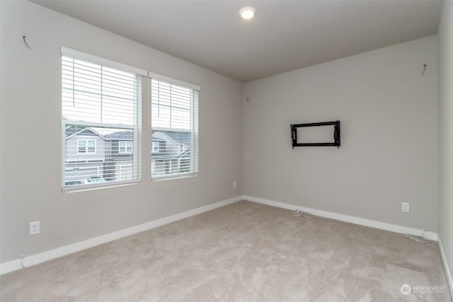 empty room with light colored carpet