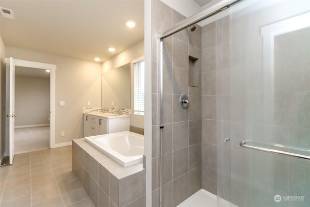 bathroom featuring tile patterned floors, vanity, and separate shower and tub