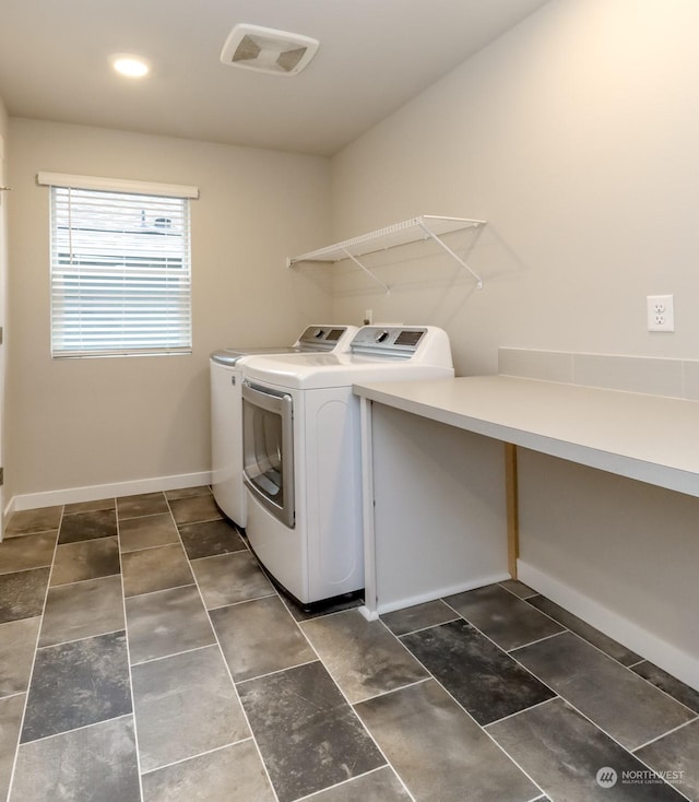 laundry room with washer and dryer