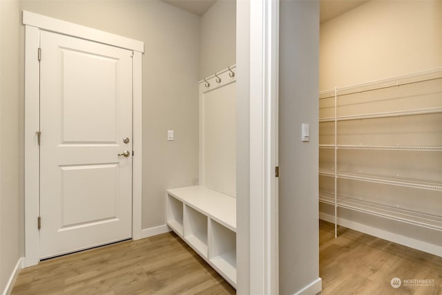 mudroom with light hardwood / wood-style floors