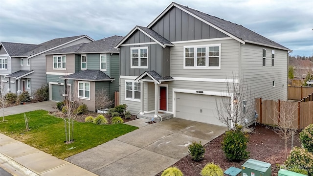 view of front of property featuring a garage and a front yard