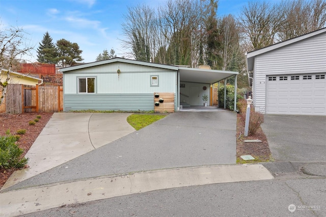 view of front facade with a garage and a carport