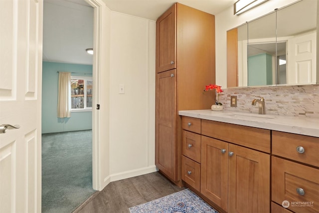 bathroom with vanity and backsplash