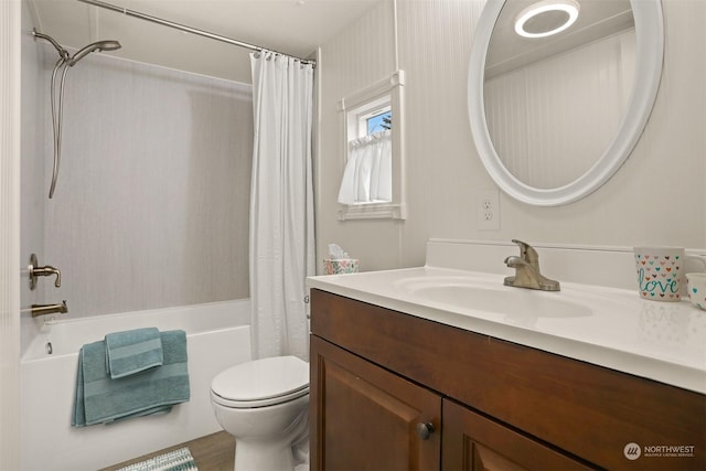 full bathroom featuring vanity, shower / tub combo with curtain, and toilet