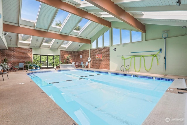 view of swimming pool with a skylight