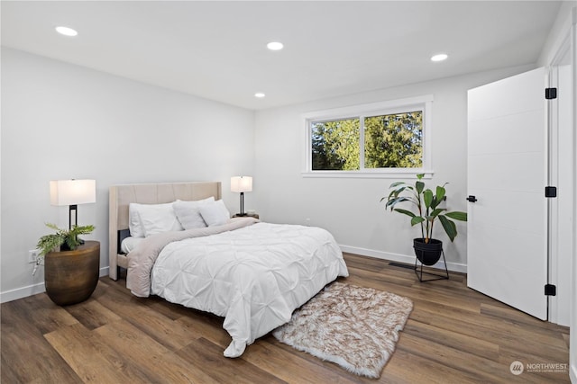 bedroom featuring dark wood-type flooring