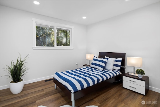 bedroom featuring dark hardwood / wood-style floors