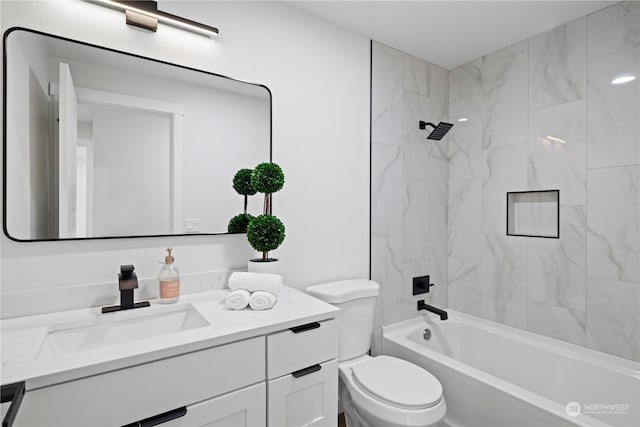 full bathroom with tiled shower / bath combo, vanity, and toilet