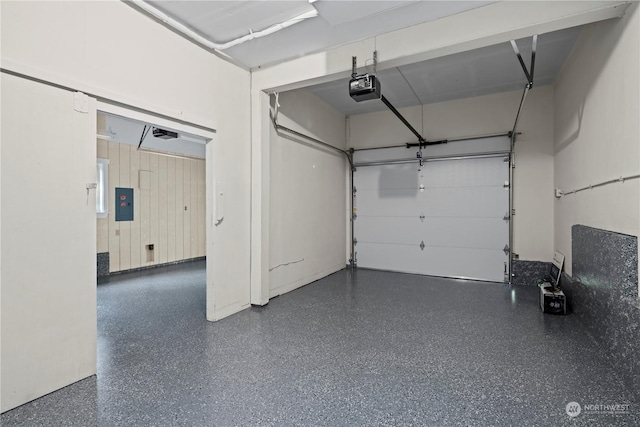 garage featuring a garage door opener and electric panel