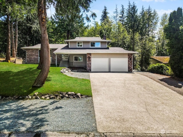 view of front facade with a garage and a front yard