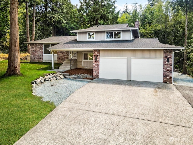 view of front of property with a garage, a front lawn, and a porch