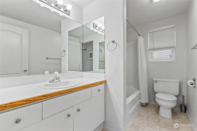 full bathroom with vanity, toilet, and shower / bath combo with shower curtain