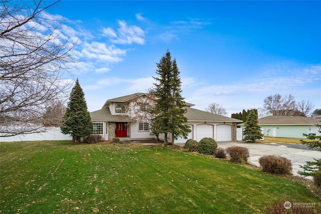 view of front facade with a garage and a front lawn