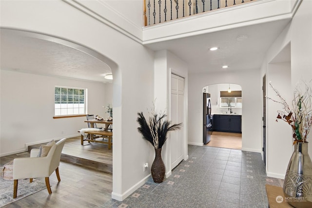 corridor with dark hardwood / wood-style flooring