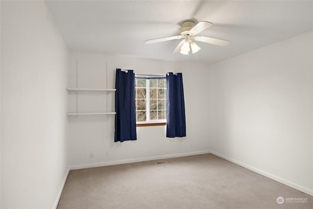 unfurnished room with carpet flooring and ceiling fan