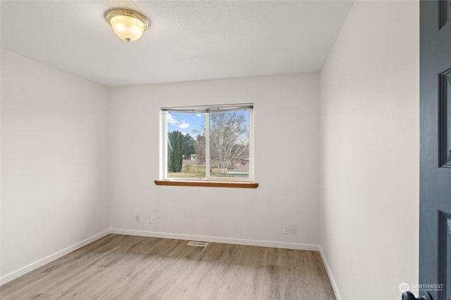 empty room with light wood-type flooring