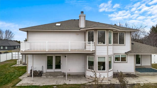 back of property with a patio area, a balcony, and central air condition unit