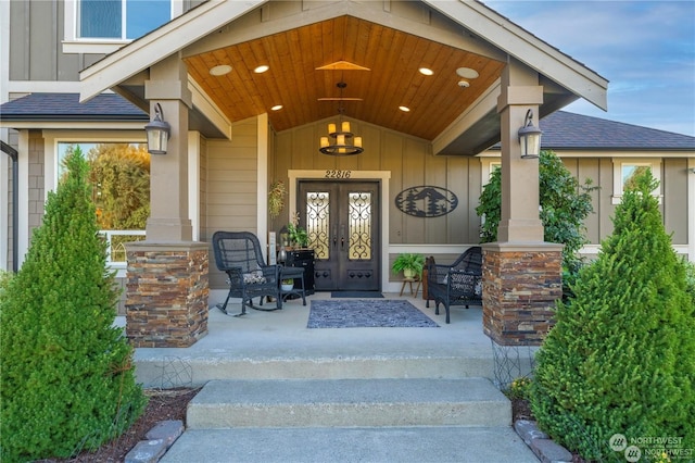 entrance to property featuring french doors and a porch