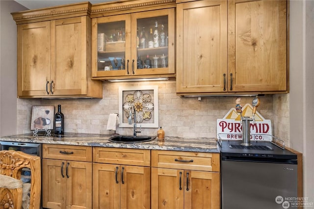 kitchen with tasteful backsplash, sink, electric range, and stone countertops