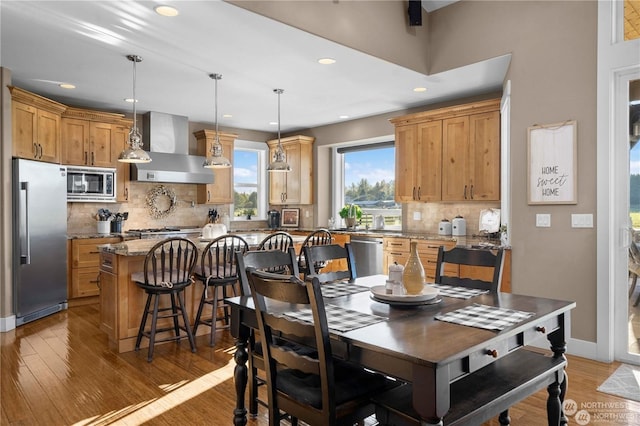 dining area with hardwood / wood-style flooring