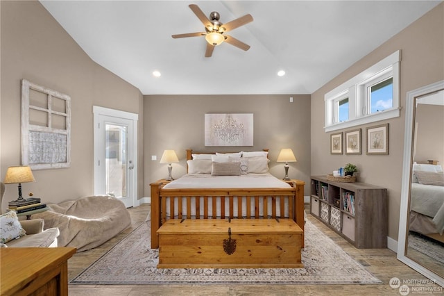 bedroom with vaulted ceiling, light hardwood / wood-style floors, ceiling fan, and access to outside