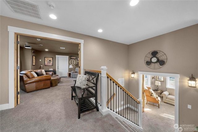 staircase with carpet floors