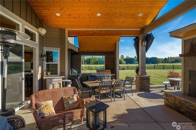 view of patio / terrace with area for grilling and a rural view