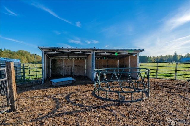 view of outbuilding with a rural view