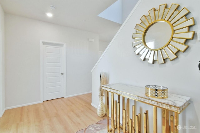 hall with light hardwood / wood-style flooring