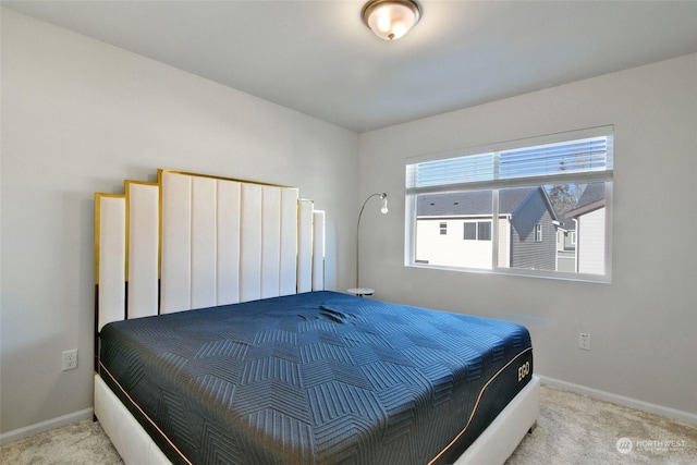 bedroom featuring light colored carpet