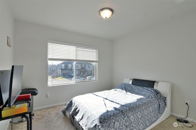 bedroom with light colored carpet