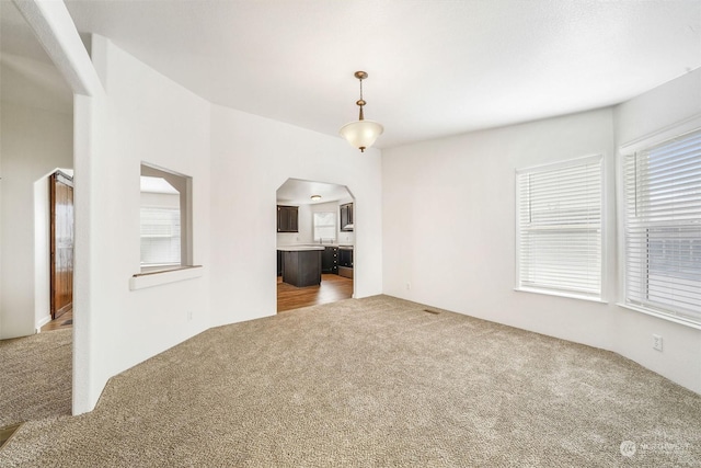 empty room featuring carpet flooring