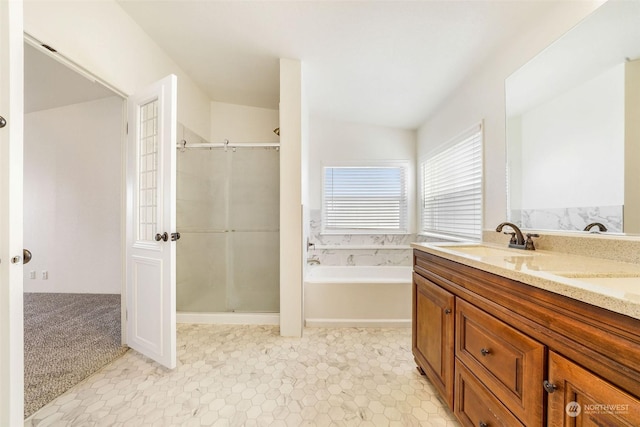 bathroom featuring independent shower and bath and vanity