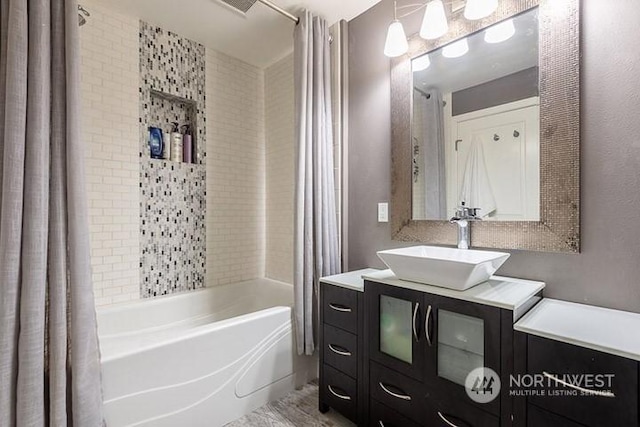 full bathroom featuring vanity and shower / bath combo with shower curtain