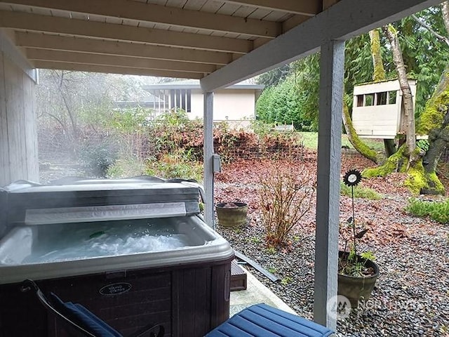 exterior space with a hot tub