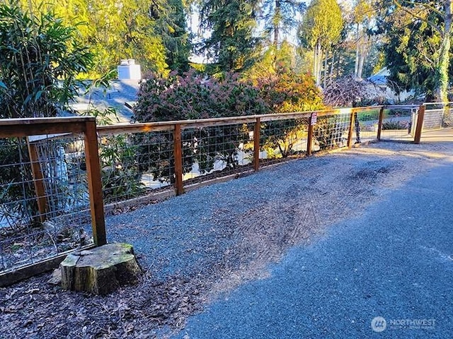 view of gate with fence