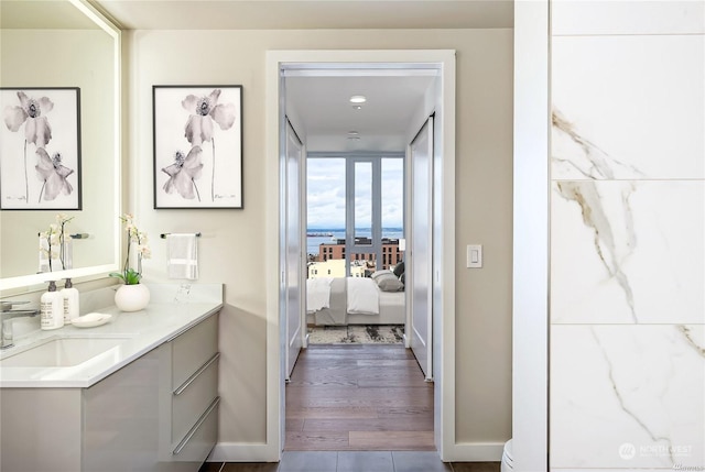 bathroom featuring vanity and wood-type flooring