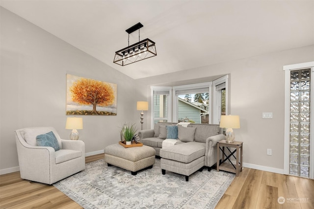 living room with lofted ceiling and wood-type flooring