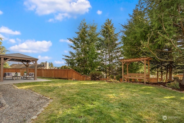 view of yard with a gazebo, outdoor lounge area, and a patio