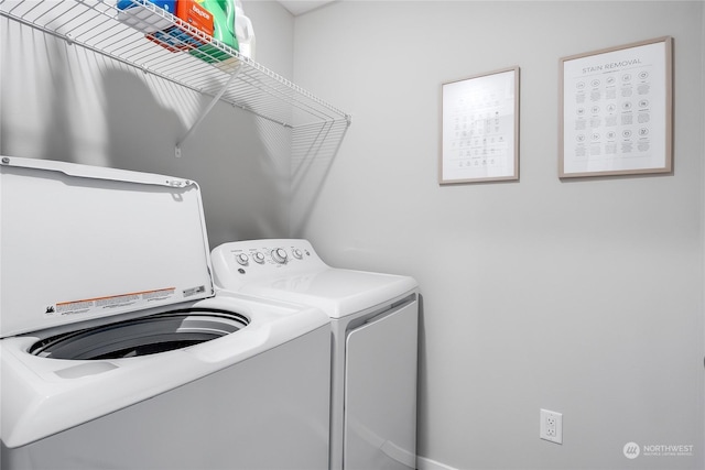 laundry area with independent washer and dryer