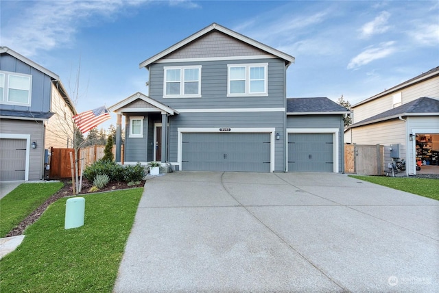 view of front of house featuring a garage and a front yard