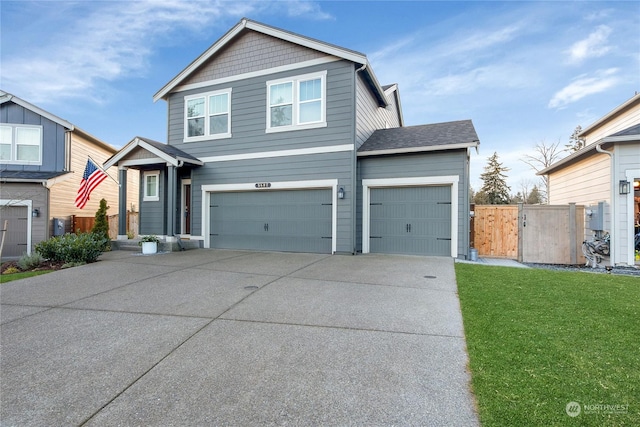 front of property with a garage and a front lawn