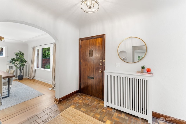 entrance foyer featuring radiator heating unit