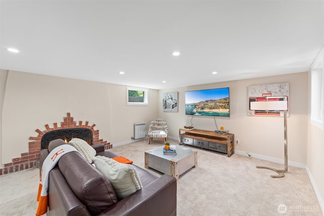 living room with radiator and light colored carpet