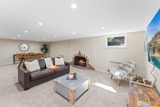 carpeted living room featuring radiator heating unit and a fireplace