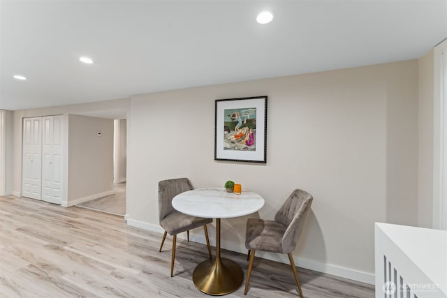 dining space with light hardwood / wood-style floors