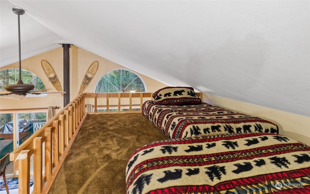 carpeted bedroom featuring vaulted ceiling