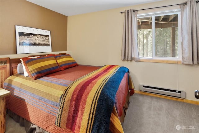 bedroom featuring baseboard heating and carpet flooring