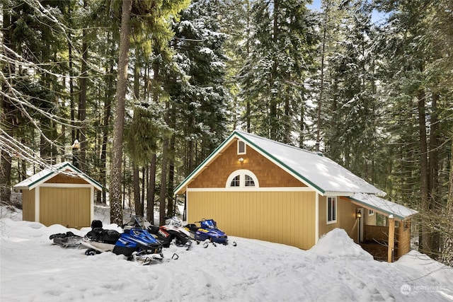 view of snow covered garage